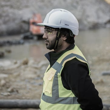 Man in hard hat and high visibility jacket.