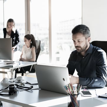 Man at desk with laptop