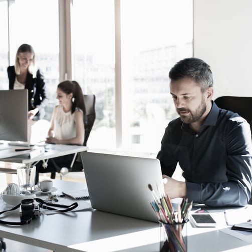 Man at desk with laptop