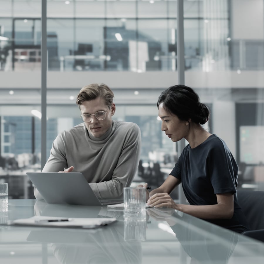 Man and woman at laptop.
