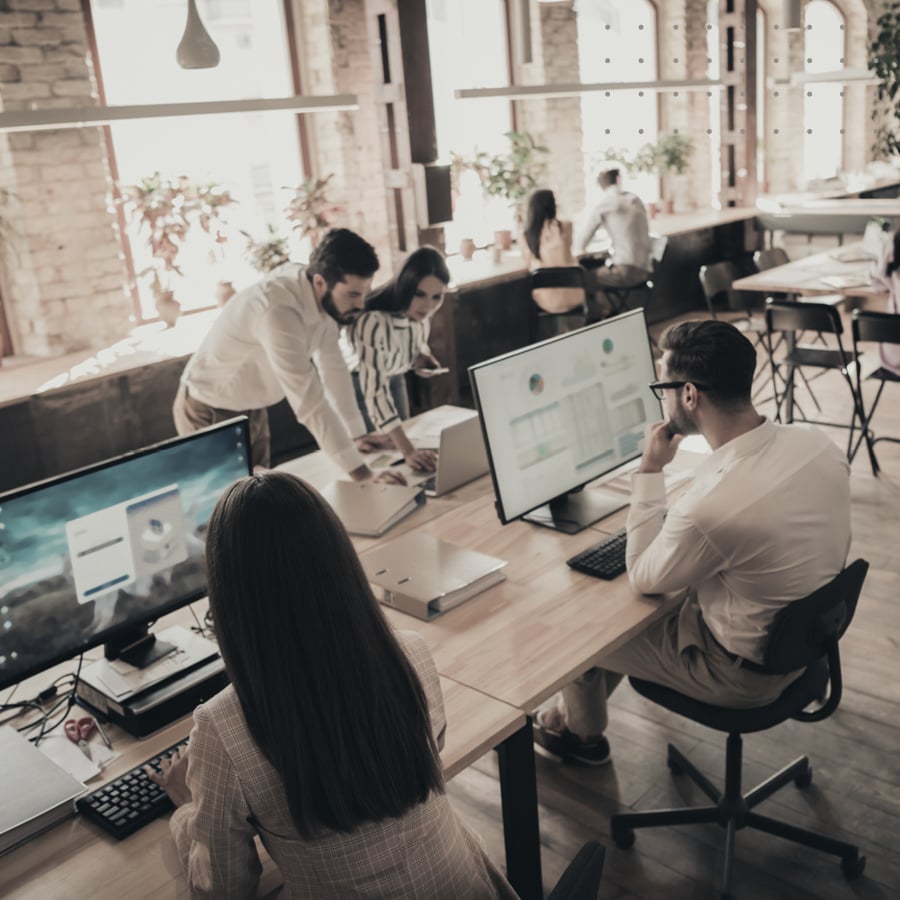 Group of people at desks.