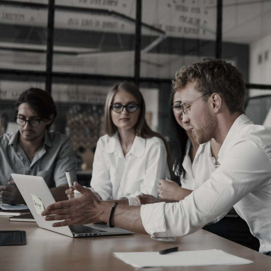 Group talking at computer.